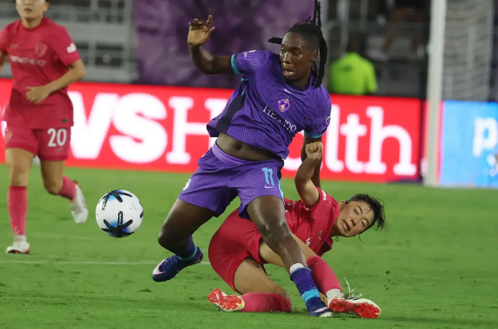 Orlando player Barbra Banda (11) runs over North Carolina player...