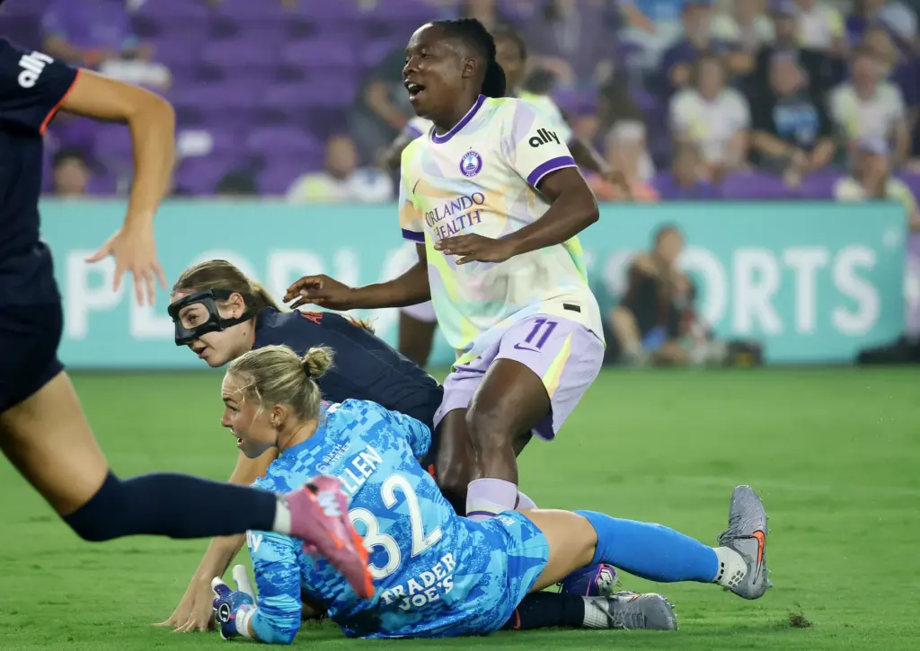 Orlando player Barbra Banda (11) starts to celebrate as she...