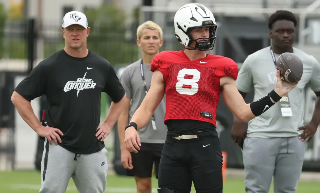 UCF quarterback Rocco Marriott (8) handles a snap as head...