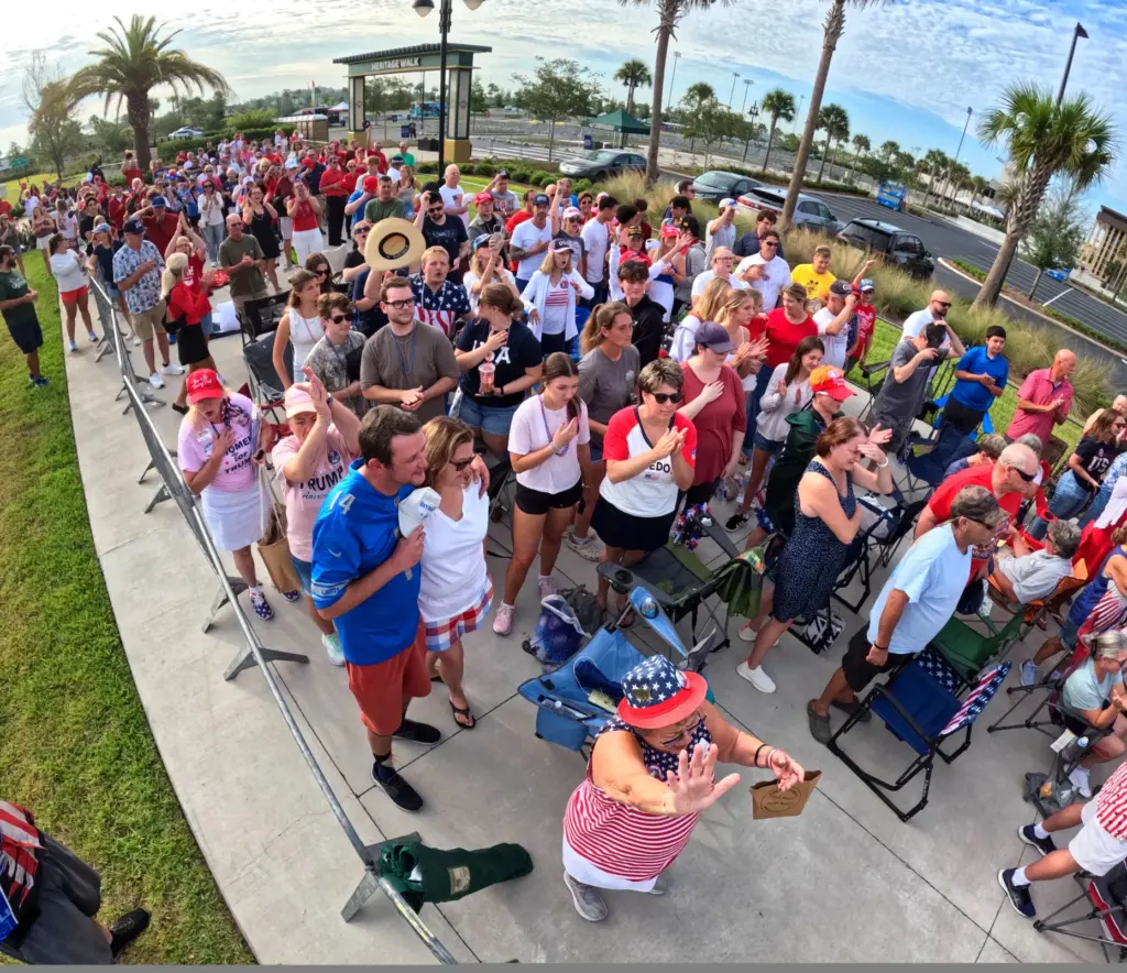 Supporters of President Donald Trump cheer while waiting for doors...