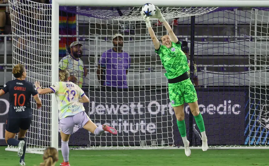 Orlando goalkeeper Anna Moorhouse leaps to make a save during...