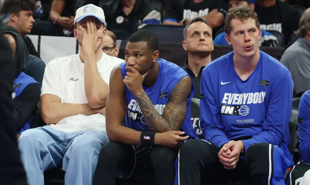Orlando players, from left: Franz Wagner, Jamal Cain, and Mo...