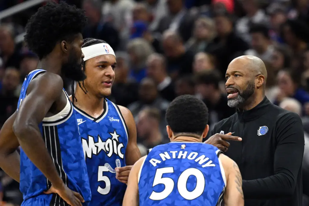 Orlando Magic coach Jamahl Mosley, right, talks with forward Jonathan...