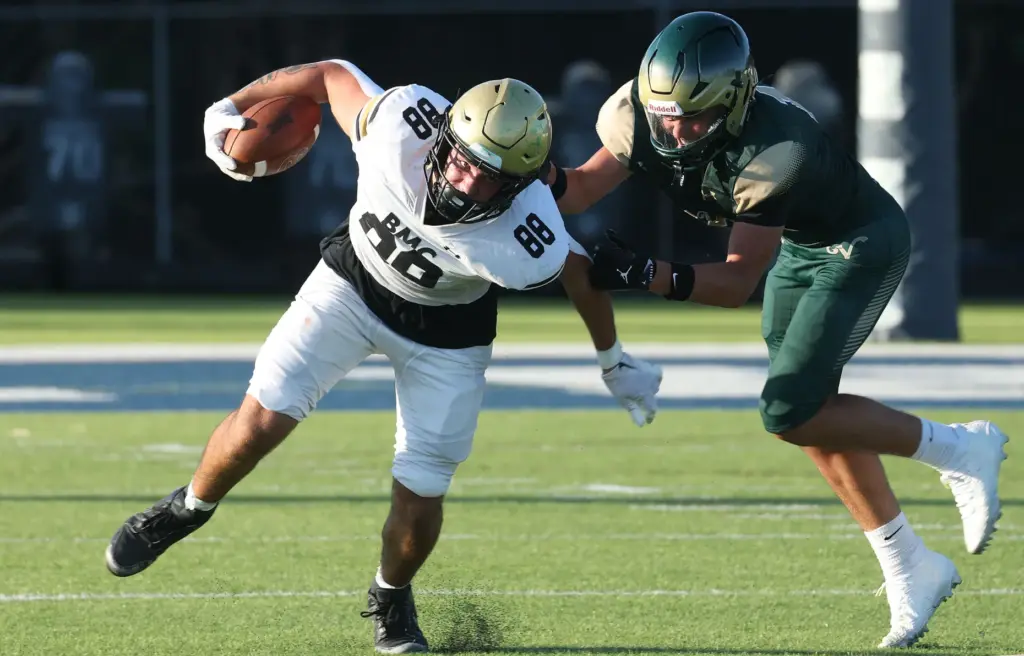 Bishop Moore tight end Drew Follett (88) runs during a...