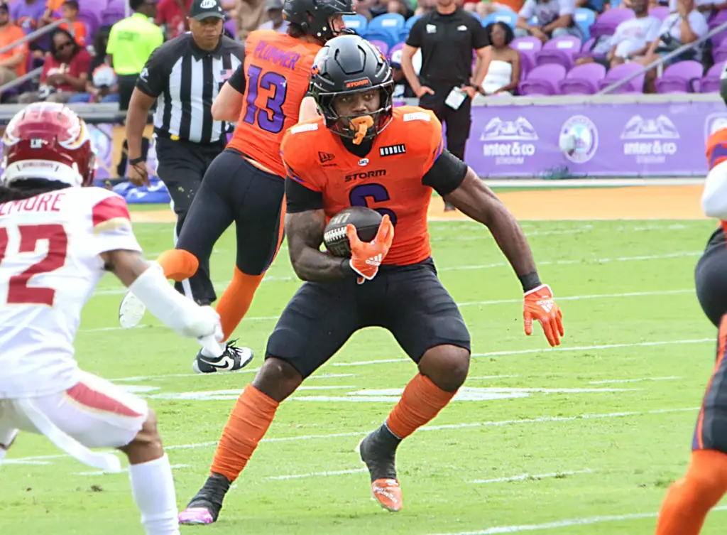 Orlando running back Jashaun Corbin looks for room to run...