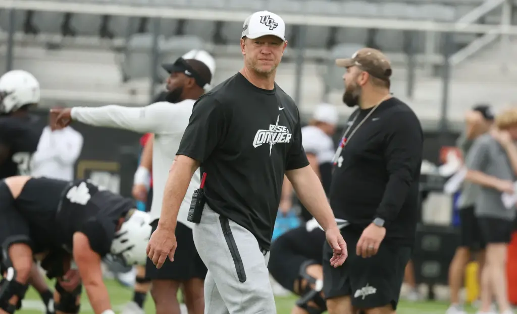 UCF head coach Scott Frost watches during UCF practice Saturday at the Acrisure Bounce House Stadium. (Stephen M. Dowell/Orlando Sentinel)