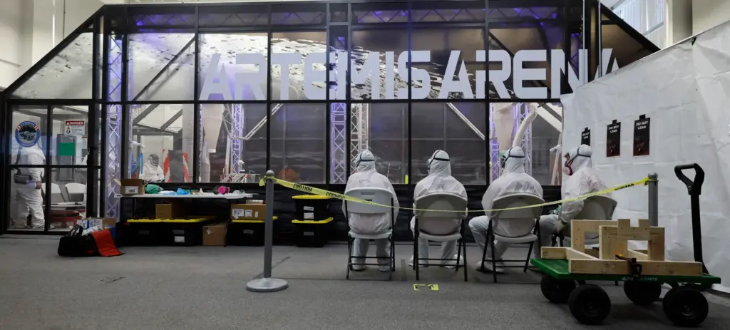 The University of Alabama team members watch their robot make...