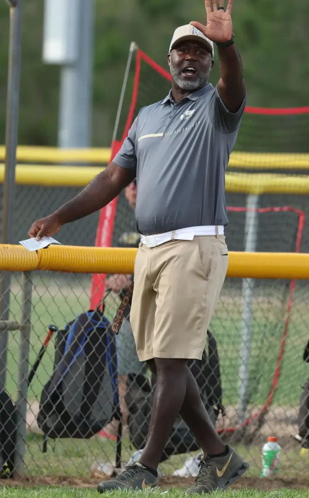 East Ridge High softball coach Al Peterson signals during the...