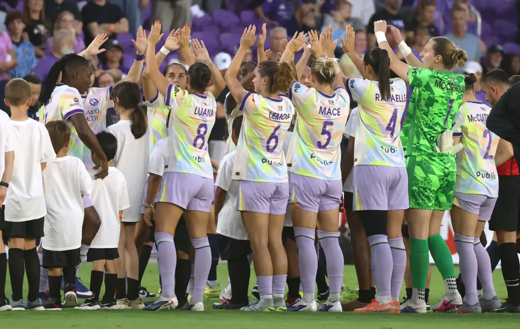Teams greet before the start of the Bay FC at...
