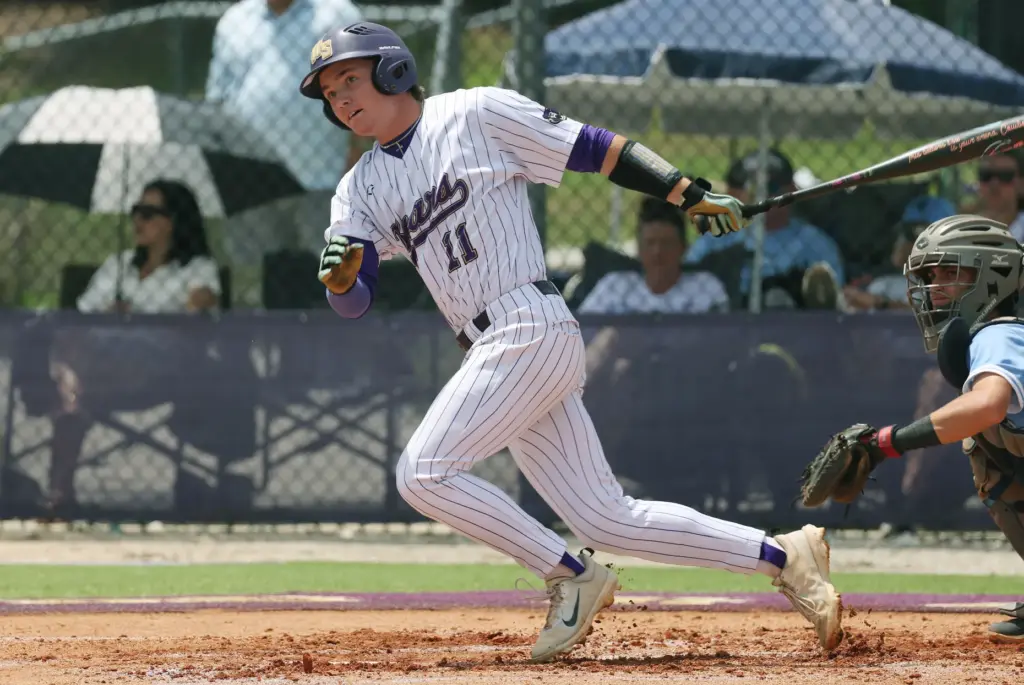 Winter Springs High baseball player Owen Swanson hits during the...