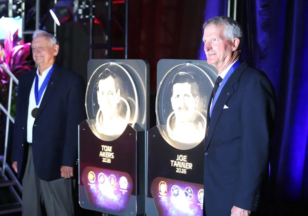 Former astronauts Tom Akers, left, and Joe Tanner stand with...