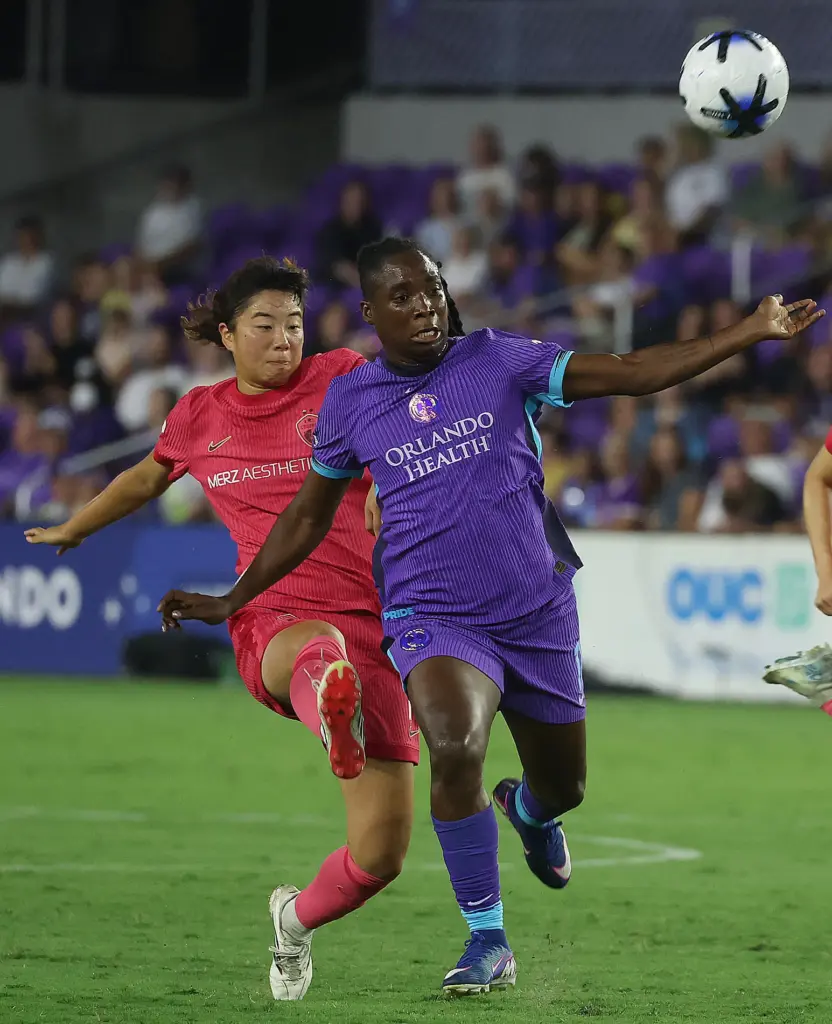 Orlando player Barbra Banda (right) chases the ball in front...