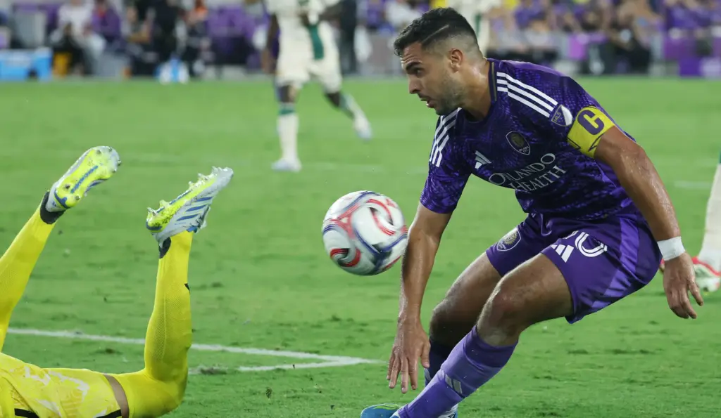 Orlando player Martin Ojeda (right) can't quite get the ball...