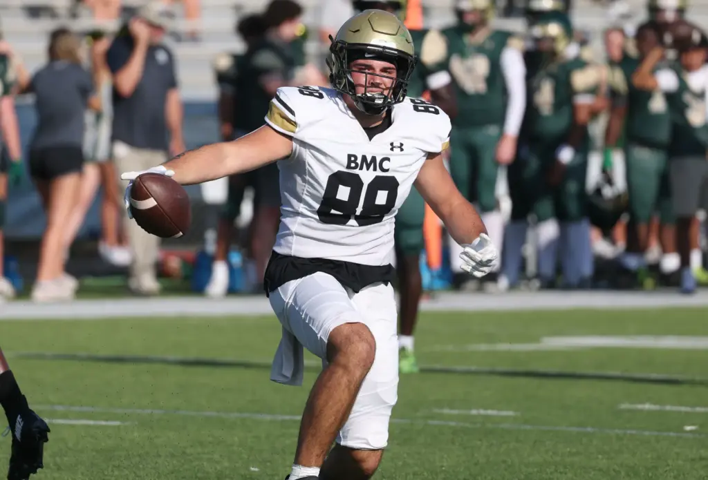 Bishop Moore tight end Drew Follett runs ater a catch...