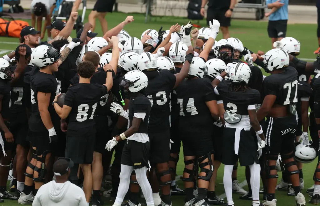 UCF players gather during UCF Football Open Practice at the...