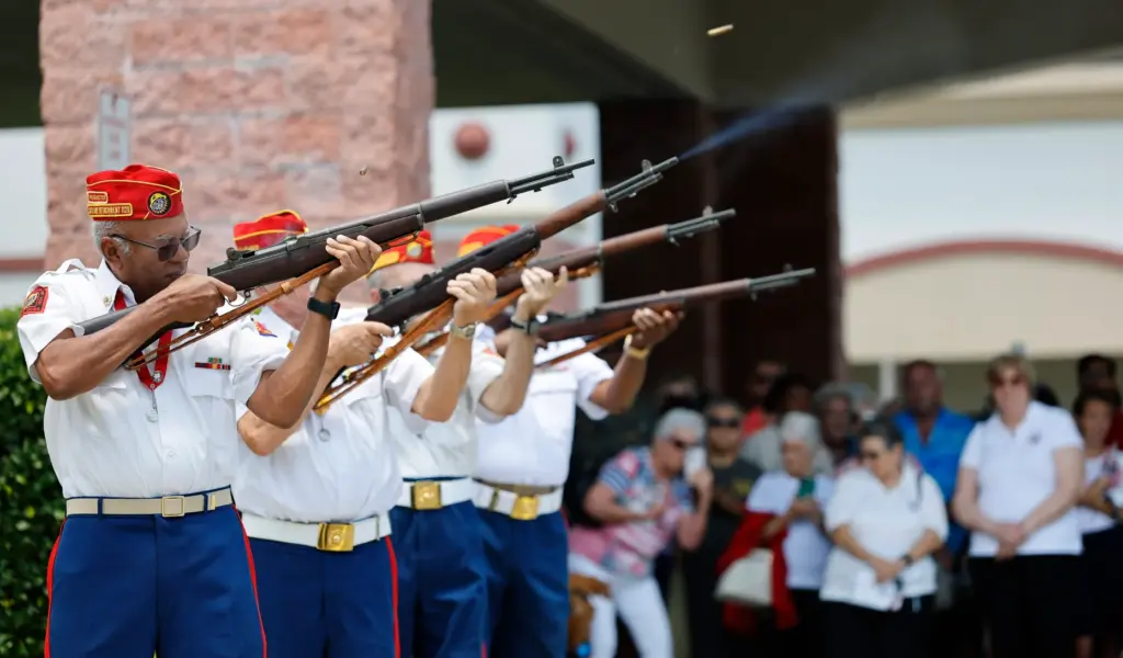 The Marine Corps League Detachment 1120 fires a rifle salute...
