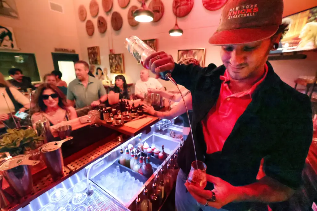 Jose Casalan pours a serving during the release party of...
