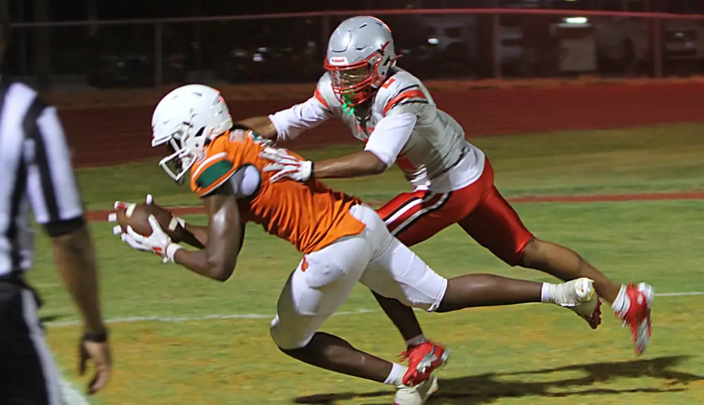 Jones sophomore receiver Cameron Tooley catches a second-half touchdown pass against Lake Mary in a spring game Wednesday night. (Chris Hays/Orlando Sentinel)