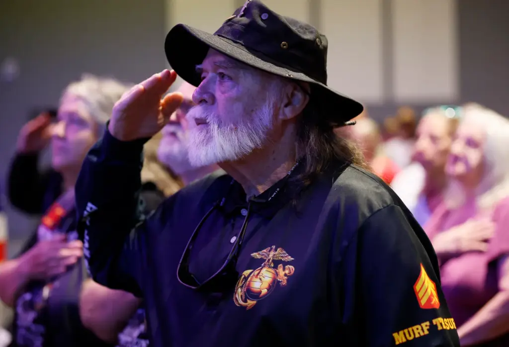USMC veteran William Murphy salutes during the Memorial Day ceremony...