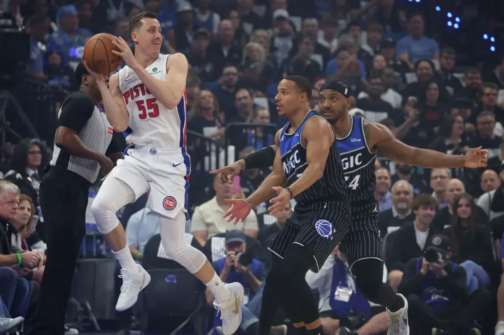 Detroit guard Duncan Robinson (55) leaps to control the ball...