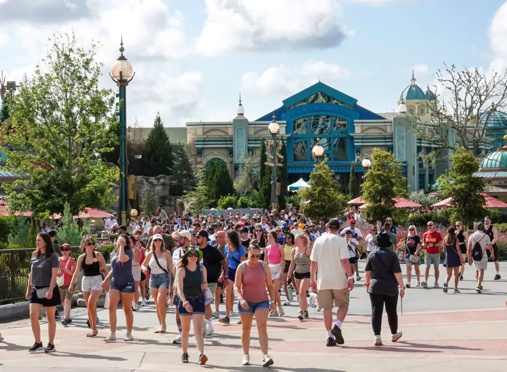 Theme park visitors stream through the Celestial Park section of...