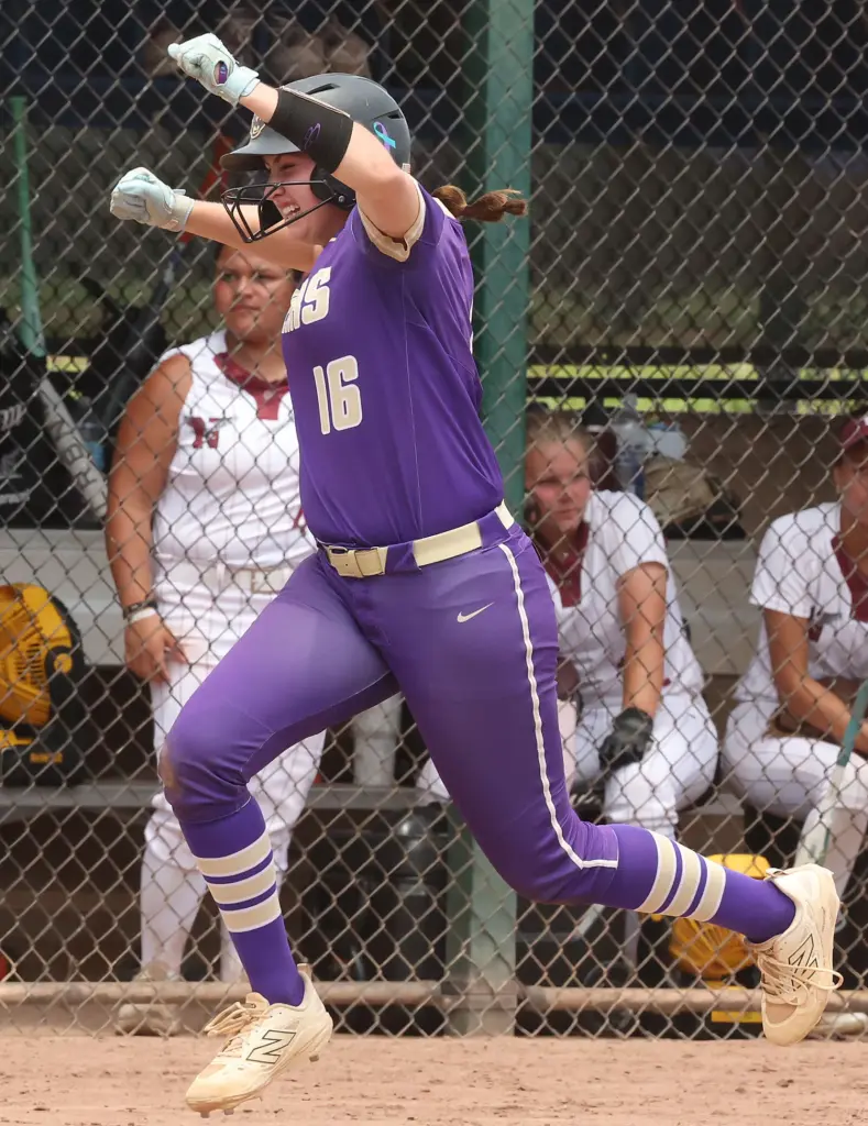 Winter Springs player Abigail Hooper (16) celebrates as she rounds...