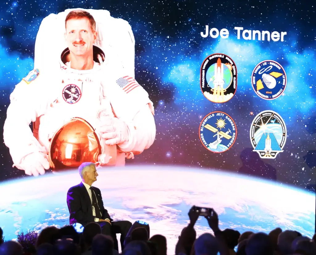 Former NASA astronaut Joe Tanner sits on stage during the...