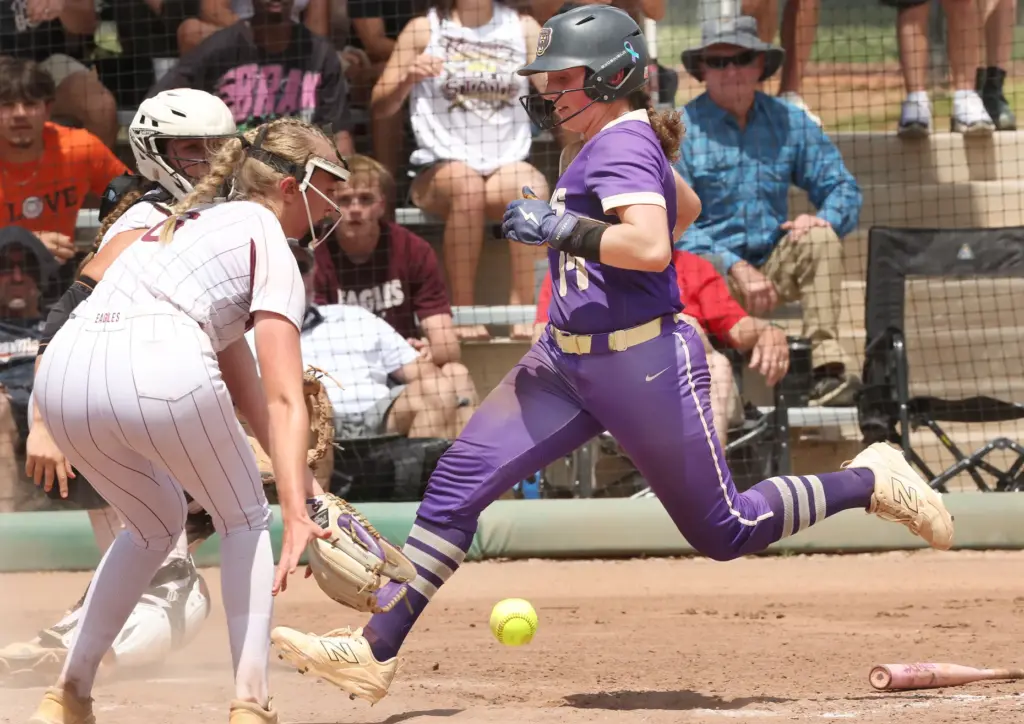 Winter Springs player Adison Pierce (17) crosses the plate ahead...