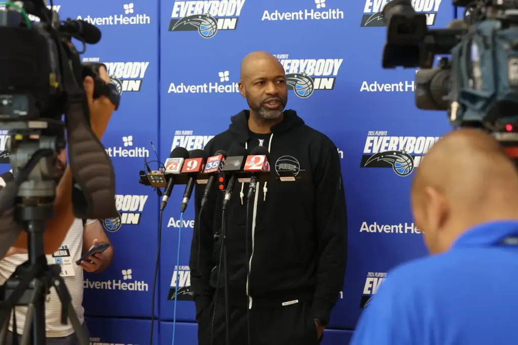 Orlando Magic coach Jamahl Mosley speaks with members of the...