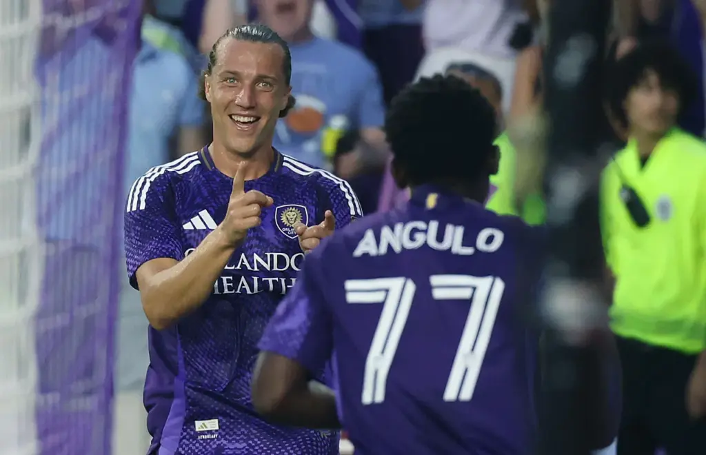 Orlando City's Griffin Dorsey (24) celebrates with teammate Ivan Angulo...