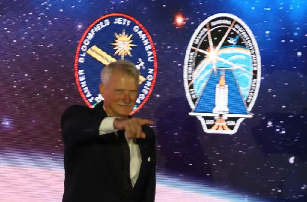Former NASA astronaut Joe Tanner walks on stage during the...