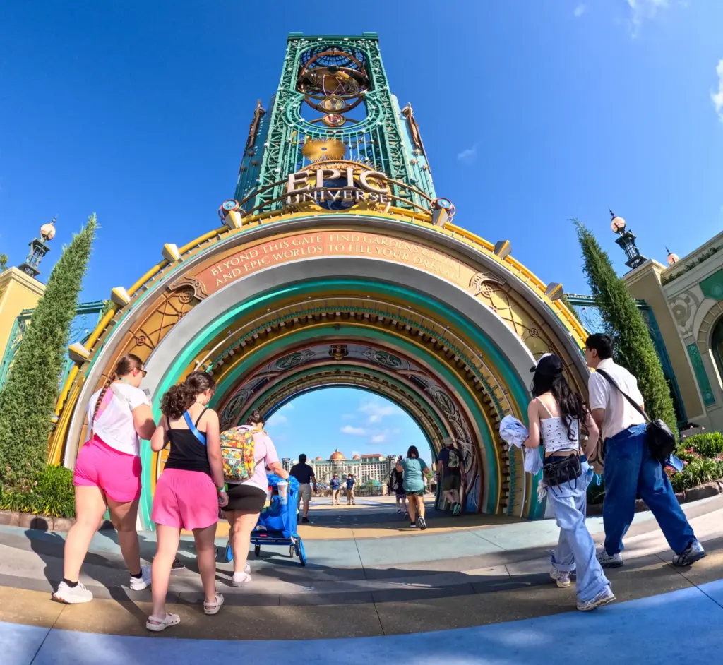 Guests arrive at the entrance of Epic Universe, on the...