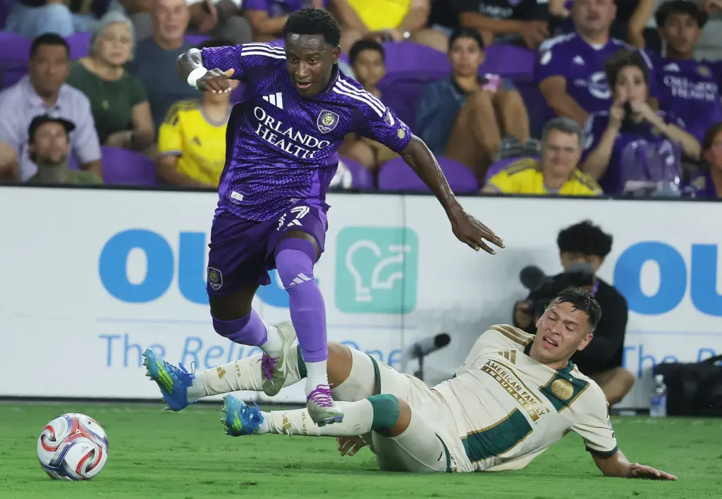 Orlando player Ivan Angulo (77) leaps over Atlanta player Elias...