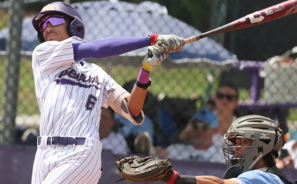 Winter Springs High baseball player Manny Sanchez hits during the...