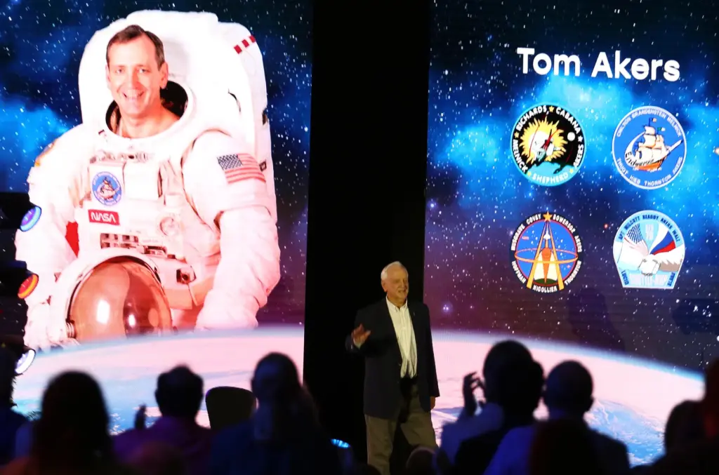 Former NASA astronaut Tom Akers enters the stage during the...