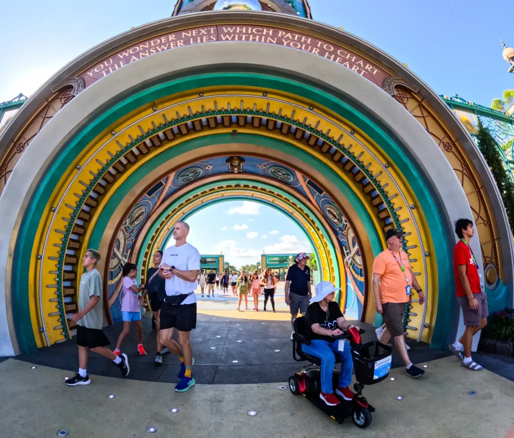 Guests arrive at the entrance of Epic Universe, on the...