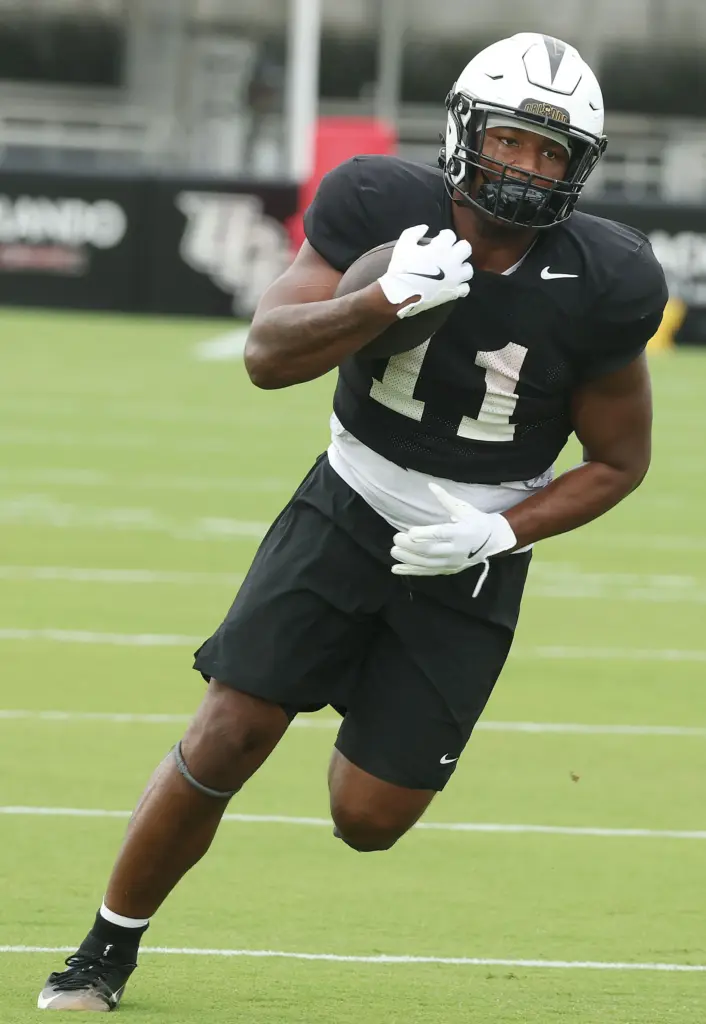 UCF running back Landen Chambers runs during UCF Football Open...