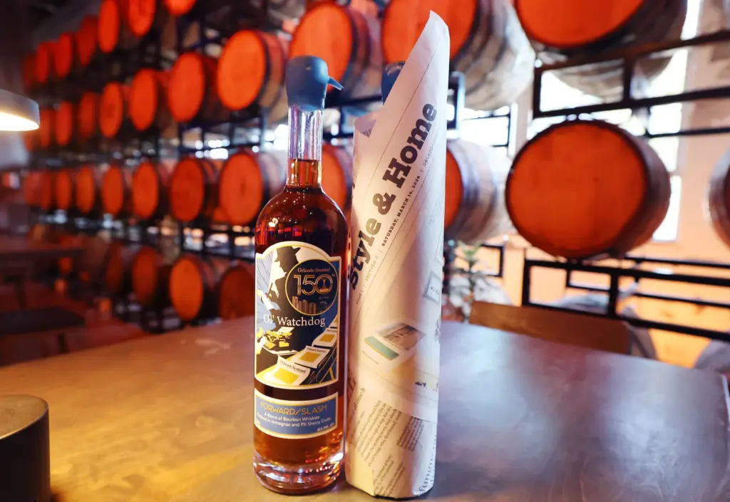 A bottle with the signature label is pictured beside another...