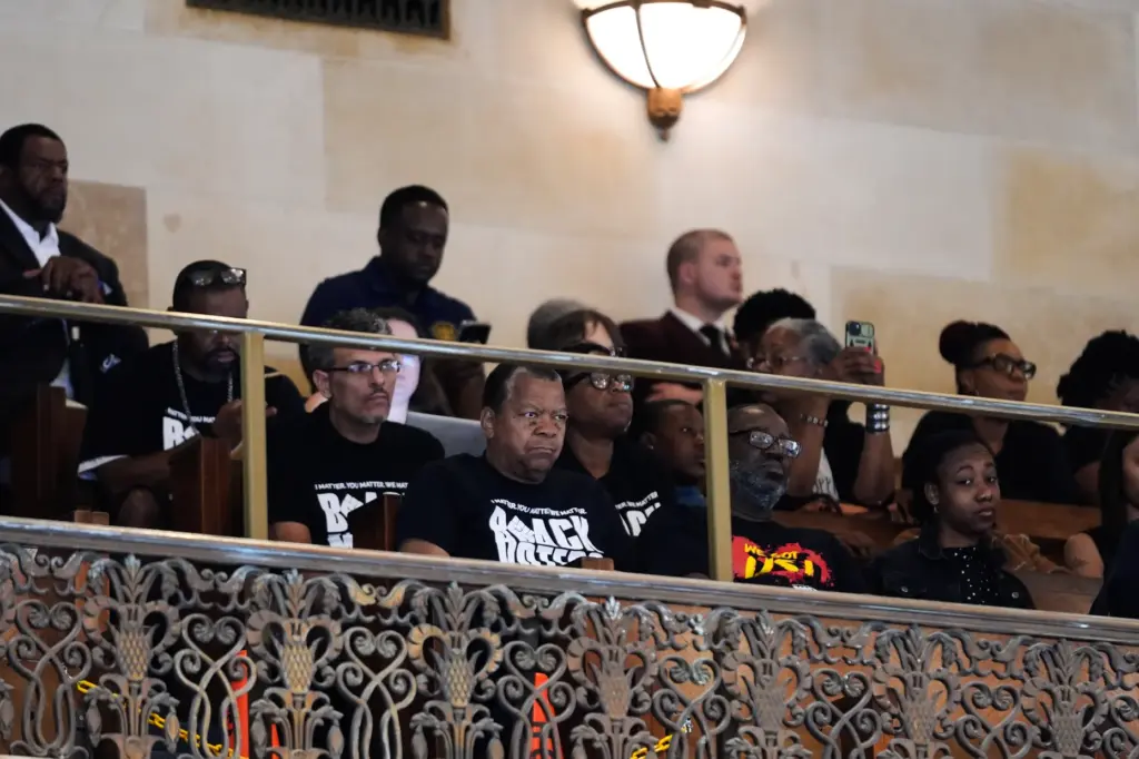 Members of the public who oppose a redistricting plan to...