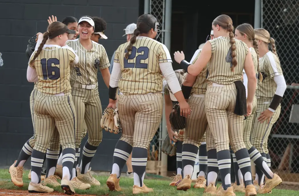East Ridge High softball players gather during the Class 7A...