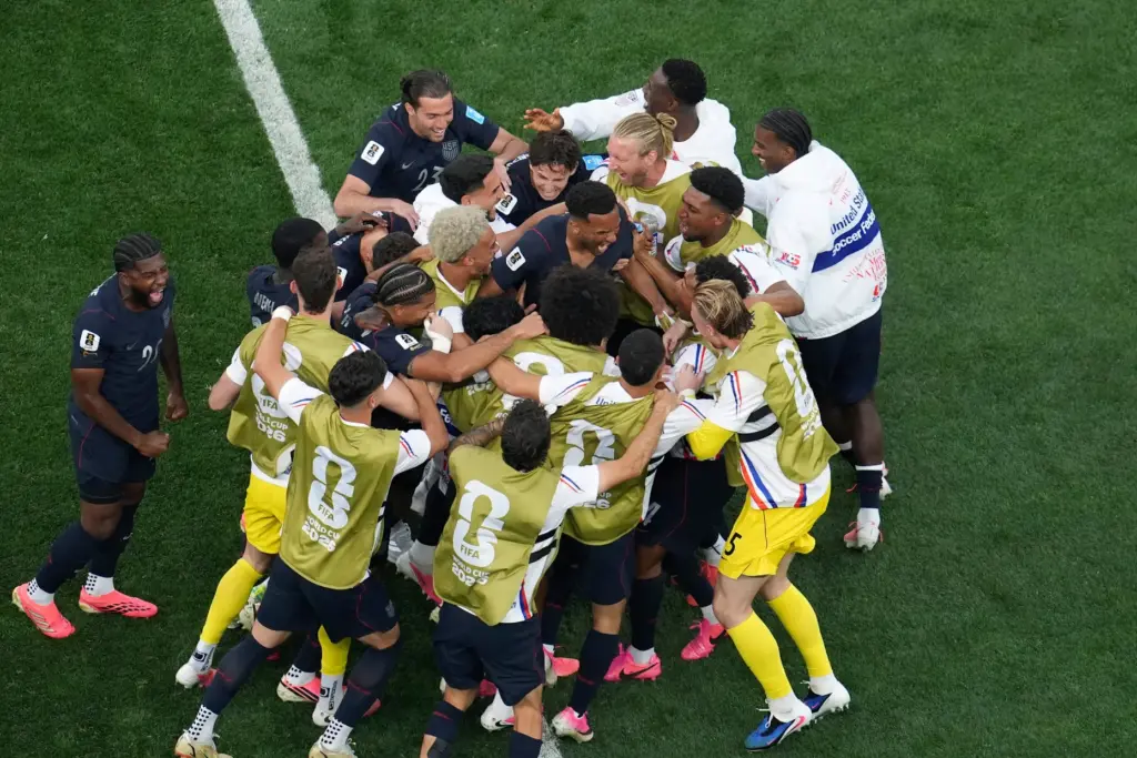 United States’ Auston Trusty celebrates with teammates after scoring his...