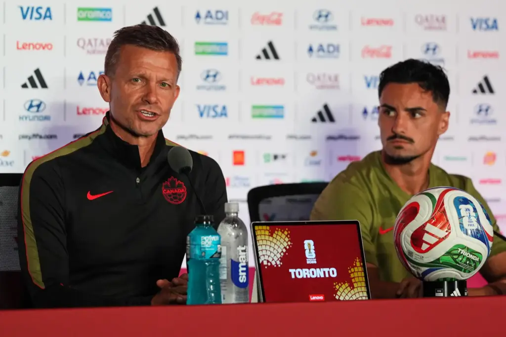 Canada head coach Jesse Marsch, left, with Stephen Eustaquio, speaks...
