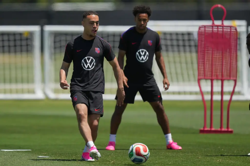 United States’ Sergino Dest, left, and teammate Tyler Adams practice...