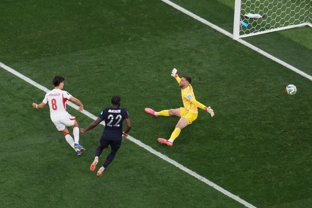 Turkey’s Arda Guler (8) scores his side’s first goal sending...