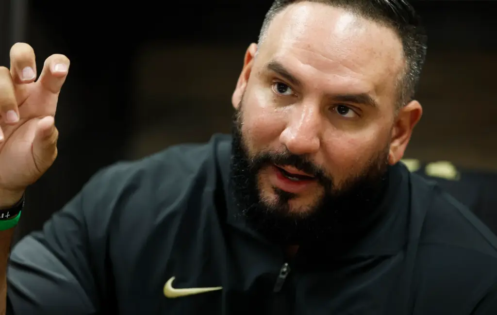 UCF women's basketball coach Gabe Lazo in his new office,...