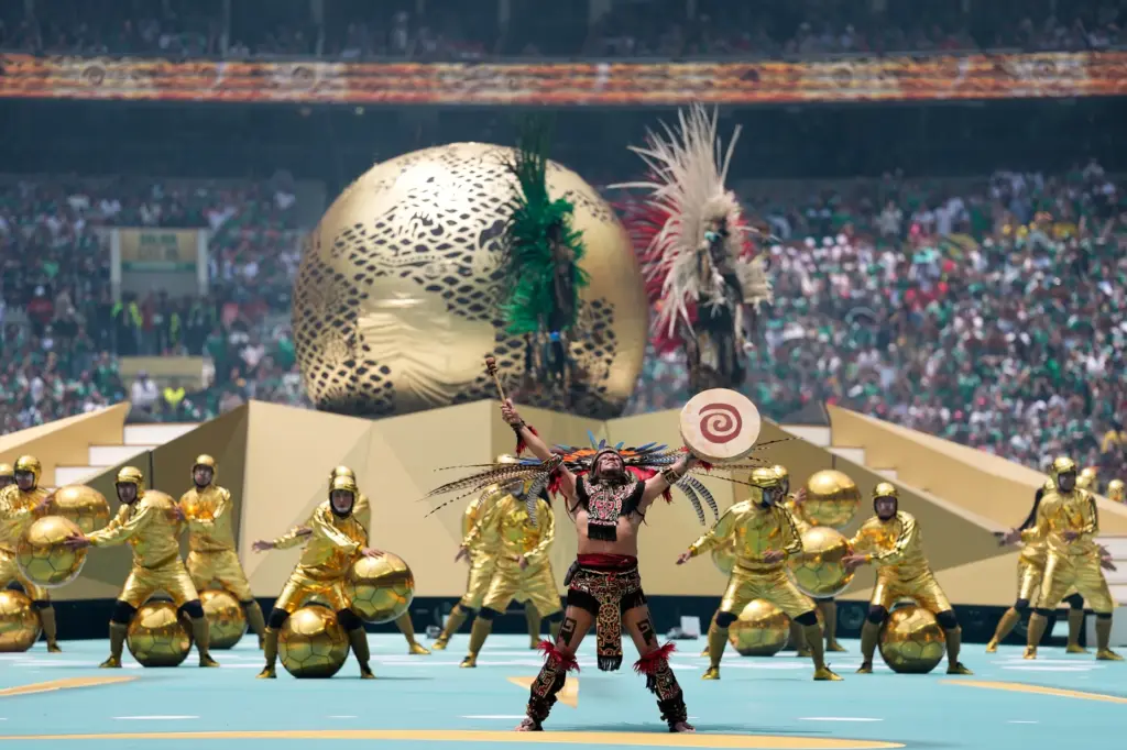 Performers on the pitch during the opening ceremony before the...