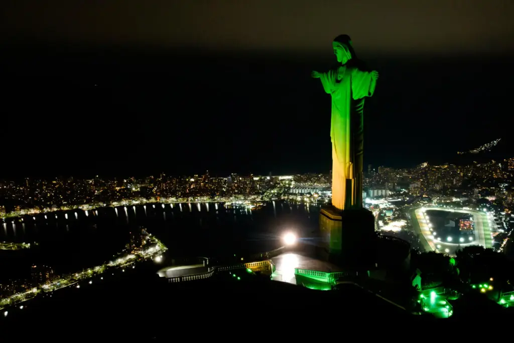 Christ the Redeemer monument is illuminated in Brazil’s national colors...