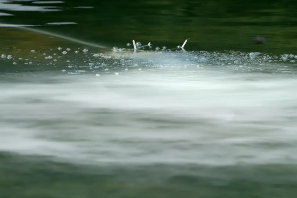 Bubbles emanate from a hose in the Lincoln Memorial Reflecting...