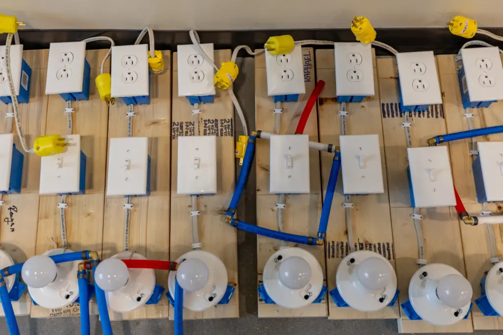 Construction projects, including an electrical training board and pipe plumbing...