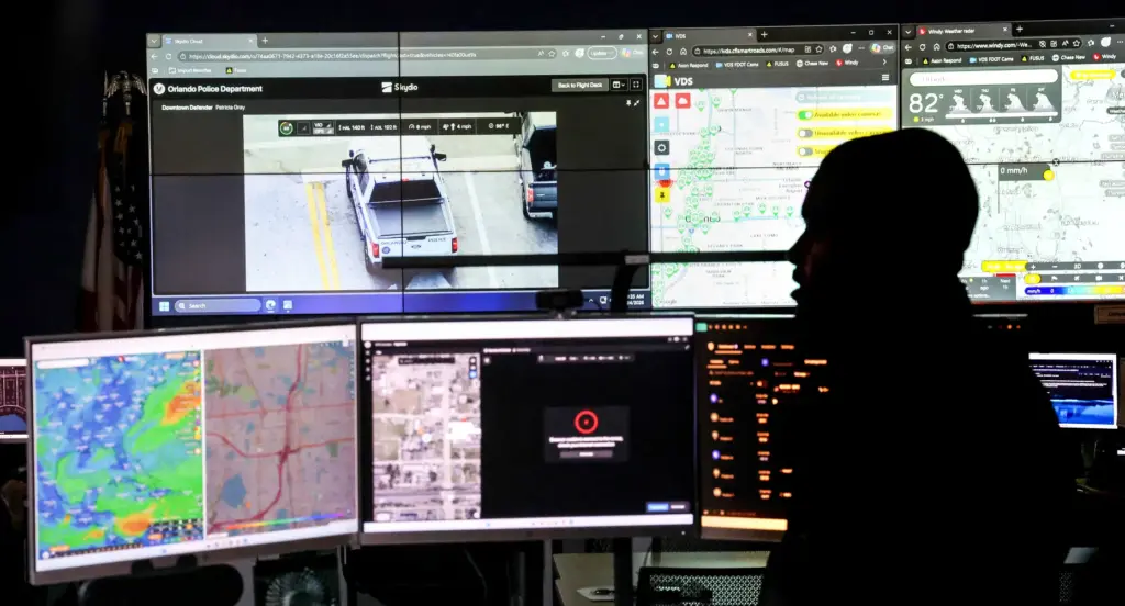Orlando Police drone pilot Officer Todd Montford navigates from the...